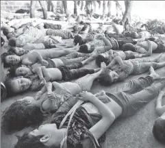  ?? ?? Pure evil: Victims of a chemical-weapon attack lie dead in eastern Ghouta, on the outskirts of Damascus, in August 2013.