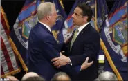  ?? RICHARD DREW — THE ASSOCIATED PRESS ?? New York Gov. Andrew Cuomo, right, talks with former Vice President Al Gore after signing the Climate Leadership and Community Protection Act on Thursday at Fordham University in New York.