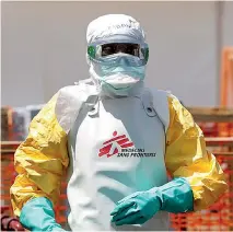  ??  ?? A worker in protective gear disinfects an ambulance carrying a suspected Ebola patient in DR Congo, amid claims that responses to epidemics so far have been ‘grossly insufficie­nt’