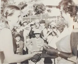  ??  ?? Rebecca Wilson receives the St Hilda’s School inter-house swimming award in 1976.