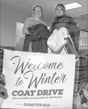  ?? CAPE BRETON POST PHOTO ?? CBU staff members Lenore Parsley, left, and Sonya MacDonald put coats in a donation box for the Welcome to Winter coat drive.