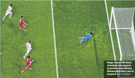  ?? /GETTY IMAGES ?? Diego Costa (19) inicia el festejo tras superar al portero iraní Alireza Beiranvand (der.), por el Grupo B.