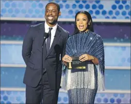  ?? Christophe­r Polk NBC ?? STERLING K. BROWN and Susan Kelechi Watson speak from the Beverly Hilton Hotel on Sunday. “It’s great to be Black at the Golden Globes,” Brown said.