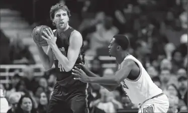  ?? ARMANDO L. SANCHEZ/TRIBUNE NEWS SERVICE ?? Chicago Bulls forward Bobby Portis (5) guards Dallas Mavericks forward Dirk Nowitzki (41) on Tuesday in Chicago.