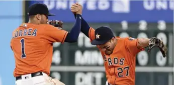  ?? ERIC CHRISTIAN SMITH/THE ASSOCIATED PRESS ?? Astros shortstop Carlos Correa, left, and second baseman Jose Altuve are franchise cornerston­es in Houston.