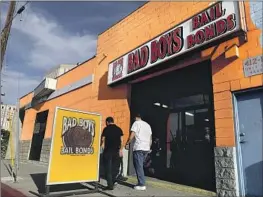  ?? Gary Coronado Los Angeles Times ?? THOSE arrested by Los Angeles police or the L.A. County Sheriff ’s Department will no longer have to post cash bail. Above, a bail agent near the county jail.