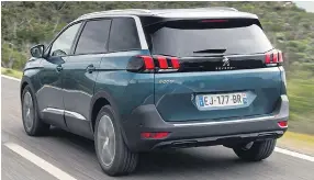  ??  ?? LOOKING GOOD: The digital speedo and dash design, left, is elegant and simple while outside the Peugeot boasts clever styling accents at the rear