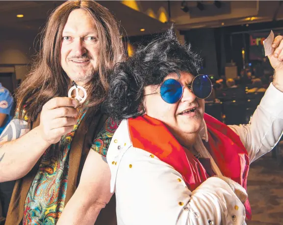  ?? Picture: Kevin Farmer ?? ROCK ON: Breaking Free organiser Michael Burge (left) parties hard with Robert Bishop at the City Golf Club.