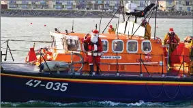  ??  ?? The Annie Blaker drops Santa Claus off at the Lifeboat Station in Wicklow town.