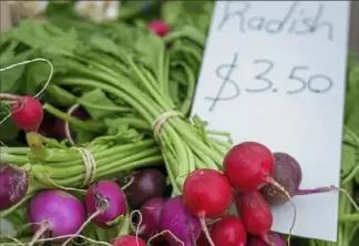  ?? Steve Mellon/Post-Gazette photos ?? Radishes in a variety of hues offered at the Bethel Park Farmers Market at South Park.