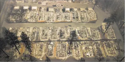  ?? Noah Berger ?? Residences leveled by the wildfire in Paradise, Calif., are seen Thursday. The Associated Press