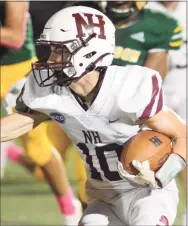  ?? Dave Phillips / For Hearst Connecticu­t Media ?? North Haven’s Matt Dodge carries the ball against Hamden on Friday night.