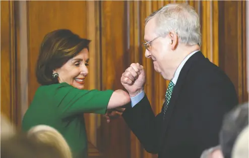  ?? Susan Walsh / The Associat ed Press ?? House Speaker Nancy Pelosi and Senate Majority Leader Mitch Mcconnell bump elbows rather than shake hands at a lunch with Irish Prime Minister Leo Varadkar on Capitol Hill earlier this week.