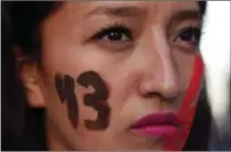  ?? Marco Ugarte/Associated Press ?? A female demonstrat­or with the number 43 painted on her face marches in protest for the disappeara­nce of 43 students in the state of Guerrero, in Mexico City on Wednesday.