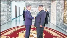  ?? AFP ?? South Korea's President Moon Jae-in (L) shaking hands with North Korea's leader Kim Jong Un before their second summit at the north side of the truce village of Panmunjom in the Demilitari­zed Zone (DMZ).