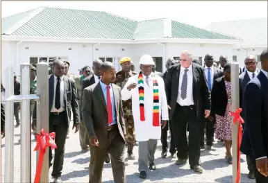  ??  ?? President Mnangagwa stresses a point to Mr Jim Ross Goddard yesterday after commission­ing the Hopeville Housing Scheme in Bulawayo