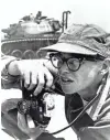  ?? JOURNAL SENTINEL FILES ?? Photograph­er Dickey Chapelle is shown taking photos on the shores of Lake Michigan during a U.S. Marines operation in 1958.