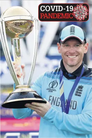  ??  ?? Skipper Eoin Morgan lifts the trophy after England win the Twenty20 World Cup in 2019, but doubts surround this year’s event taking place in Australia