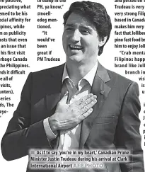  ??  ?? As if to say 'you're in my heart,' Canadian Prime Minister Justin Trudeau during his arrival at Clark Internatio­nal Airport IZA IGLESIAS
