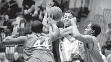  ?? KARL MERTON FERRON/BALTIMORE SUN PHOTO ?? Glen Burnie’s Auturo Archie (44) and Robert Fisher double-team Arundel’s Dexter Dunbar as he goes up for a shot.