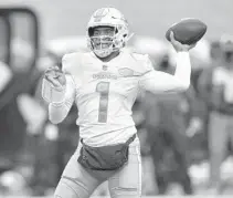  ?? ADRIAN KRAUS/AP ?? Tua Tagovailoa throws a pass during a game Jan. 3 against the Bills in Orchard Park, New York.