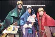  ?? Arnold Gold / Hearst Connecticu­t Media ?? Left to right, State Rep. Al Paolillo, Jr., Jhonathan Rivera of Puerto Ricans United and Joe Rodriguez as the Three Kings pose for a photograph with one-month-old Lairalys Yainamar Bayron Marrero during a Three Kings Day event at the John C. Daniels...