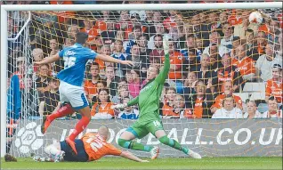  ??  ?? PLAY UP: Gareth Evans opens the scoring for Pompey after pouncing on a loose ball in the Luton area