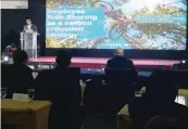  ??  ?? Globe Director for Operationa­l Risk &amp; Business Protection (ORB) Raymond Martin Aguilar speaks about employee ride sharing at the National Business Climate Action Summit 2018