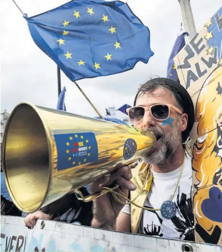  ??  ?? > A protester chants as thousands marched to Parliament Square in support of the European Union on Saturday