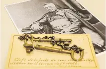  ?? ERROL MCGIHON ?? The University of Ottawa’s oldest artifact, the 169-year old keys to the door of the College of Bytown, sit alongside a photo of the founder of the institutio­n, Bishop Joseph-Bruno Guigues.