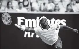  ?? MARK KOLBE Getty Images ?? Frances Tiafoe reaches for a return in his second round upset of No. 5-seed Kevin Anderson of South Africa at the Australian Open on Wednesday in Melbourne, Australia.