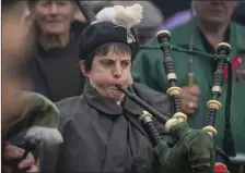  ??  ?? Piper Gillian McCarthy of the Millstreet Pipe Band performing at the Beal na Blath commemorat­ion.