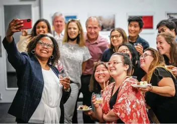  ?? Mark Mulligan / Staff photograph­er ?? Maria Reeve, shown celebratin­g the announceme­nt with newsroom colleagues, is the first person of color to lead the Houston Chronicle, the state’s largest newspaper.