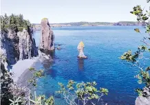  ??  ?? Ancient sea stacks line the edge of the bay near Port Rexton, N.L.