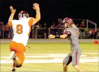  ?? MARK HUMPHREY ENTERPRISE-LEADER ?? Lincoln sophomore quarterbac­k Sterling Morphis tries to get a pass off before Gravette sophomore linebacker Colton Grimes hits him. Morphis filled in for injured senior Harrison Swayne. Gravette defeated Lincoln, 33-0, Friday.