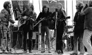  ?? Photograph: Robert Altman/ Getty Images ?? Mitchell inhabited a persona that scanned as authentic … performing with John Sebastian, Stephen Stills, Graham Nash and David Crosby at the Big Sur folk festival in 1969.