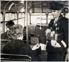  ??  ?? A conductor collects tickets inside one of the buses.