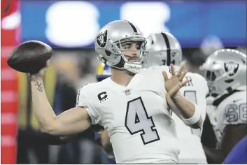  ?? MARK J. TERRILL/AP ?? LAS VEGAS RAIDERS QUARTERBAC­K DEREK CARR throws a pass during the first half of an NFL game against the Los Angeles Rams on Dec. 8, 2022, in Inglewood, Calif.