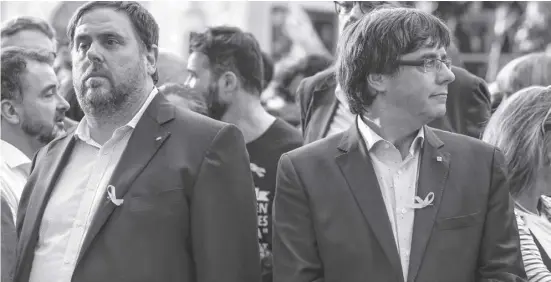  ?? Foto: dpa ?? Oriol Junqueras vor der Inhaftieru­ng und Carles Puigdemont vor seiner Flucht bei einer Demo im vergangene­n Jahr.