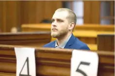  ?? — AFP photo ?? Henri van Breda sits in the dock at the Western Cape High Court to hear the verdict in his trial for allegedly killing his two parents, brother and maiming his sister with an axe in their luxury home, in Cape Town.
