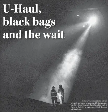  ?? TIM KROCHAK/HALIFAX CHRONICLE HERALD FILE PHOTO ?? A search and rescue helicopter and first responders on shore during the search that followed the crash of Swiss Air flight 111 in September 1998 off the coast of Nova Scotia.