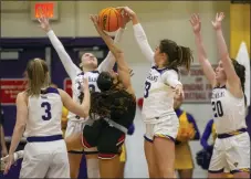  ?? TOM SILKNITTER - FOR MEDIANEWS GROUP ?? West Chester’s Anna McTamney (left) and Briana Seltzer block the shot of East Stroudsbur­g’s Ryan Weise in the first half Wednesday.