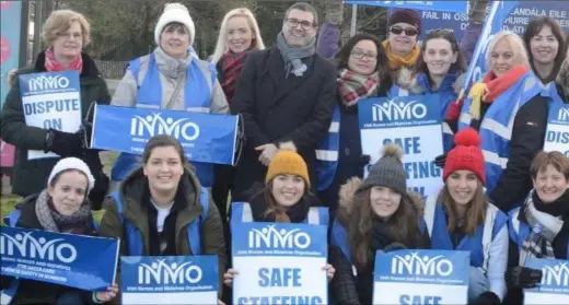  ??  ?? Striking nurses outside the Louth County Hospital pictured with INMO Industrial Relations Officer Tony Fitzpatric­k