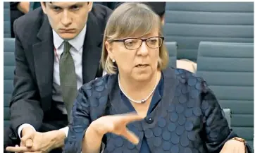  ??  ?? Alison Saunders, outgoing Director of Public Prosecutio­ns, appears before the Commons justice committee, with Sam Armstrong, acquitted of a rape, seated behind her