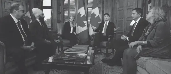  ?? ADRIAN WYLD / THE CANADIAN PRESS FILES ?? Bloc interim leader Mario Beaulieu, from left, NDP leader Jagmeet Singh, Tourism Minister Mélanie Joly, Leader of the Opposition Andrew Scheer and Green Party leader Elizabeth May listen as Justin Trudeau speaks in the prime minister’s office on francophon­e issues in Ottawa late last month.