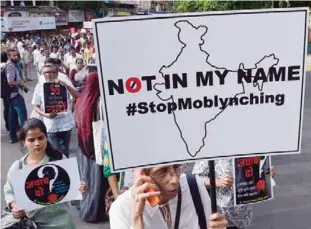  ??  ?? MUMBAI: Indian demonstrat­ors take part in a protest against a spate of murders targeting minorities under the pretext of protecting cows in Mumbai yesterday. Indian Prime Minister Narendra Modi condemned a string of murders targeting minorities under...
