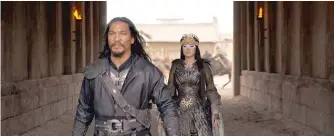  ??  ?? A vengeful warrior (Jason Scott Lee, left) teams up with a shapeshift­ing witch (Gong Li) to invade China.