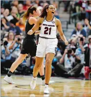  ?? SEAN D. ELLIOT/THE DAY ?? South Carolina’s Aikiah Herbert Harrigan celebrates as the Gamecocks take the lead for good in the second half of Friday’s 62-53 win over Stanford in the first national semifinal at American Airlines Center in Dallas.