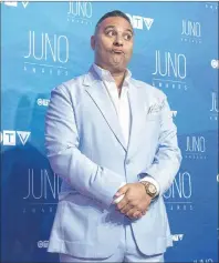  ?? CP PHOTO ?? Host Russell Peters poses on the red carpet ahead of the Juno awards show in April in Ottawa. Peters’s four-part dramedy series “The Indian Detective” will premiere on CTV Thursday.