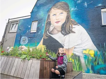  ?? Picture: Steve Brown. ?? Lucie Anderson, 8, in front of the mural in Cowdenbeat­h.
